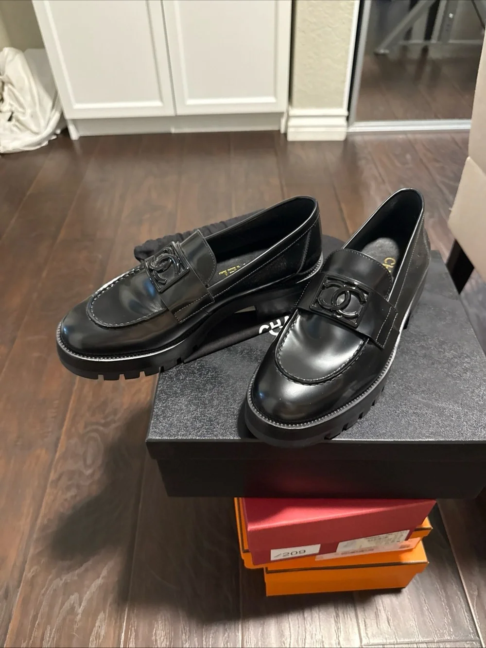 CHANEL Black on Black CC buckle loafers